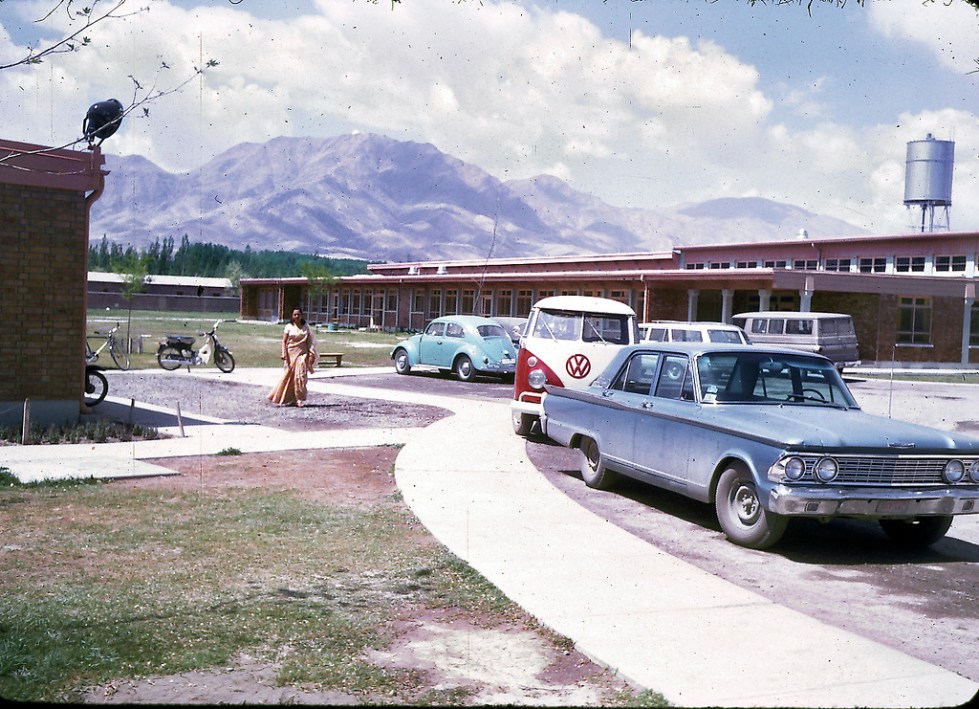 "Parking lot of the American International School of Kabul. The school no longer exists, although alumni stay in touch through Facebook and hold reunions every few years at different cities around the U.S. The next reunion will be held in Boston in 2013. "AISK's last year was 1979, so the school had a 20 year history. AISK was located on the same campus that currently houses the American University of Afghanistan (on Darul-aman Rd in west Kabul). In 1967-68, there were about 250 students attending AISK and 18 graduating seniors." - Peg Podlich"